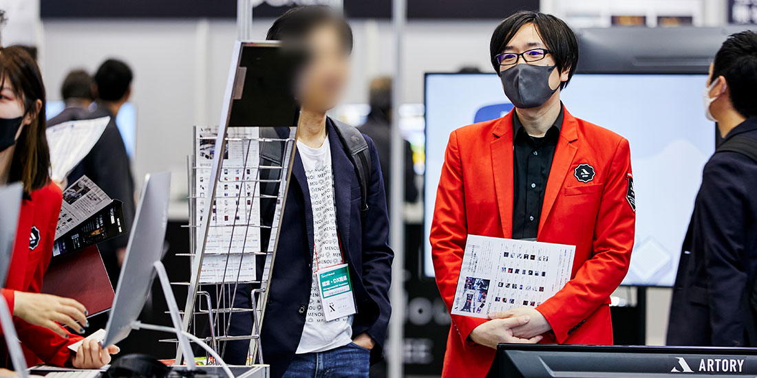 ブースに掲載されている事例について説明